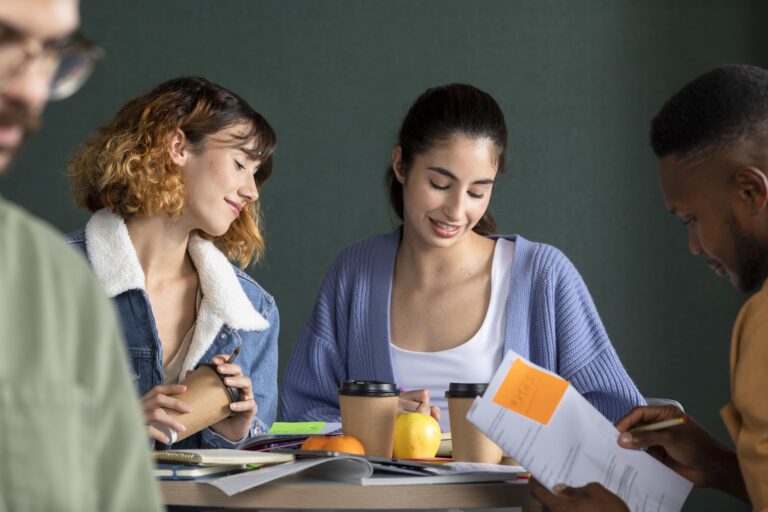 young-man-showing-his-friends-his-notes-study-session-1-768×512-1